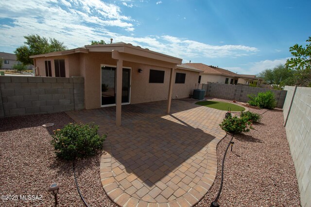 8769 E Green Branch Ln, Tucson, AZ 85730 - rear view of house featuring central AC, a fenced backyard, a patio area, and stucco siding