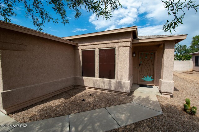 8769 E Green Branch Ln, Tucson, AZ 85730 - doorway to property with stucco siding
