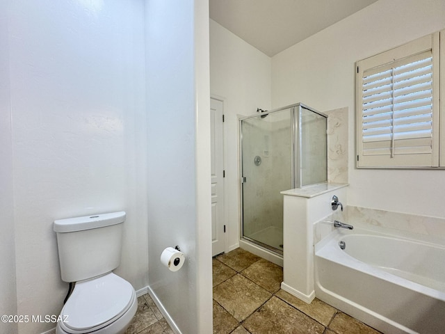bathroom with baseboards, a shower stall, toilet, and a bath