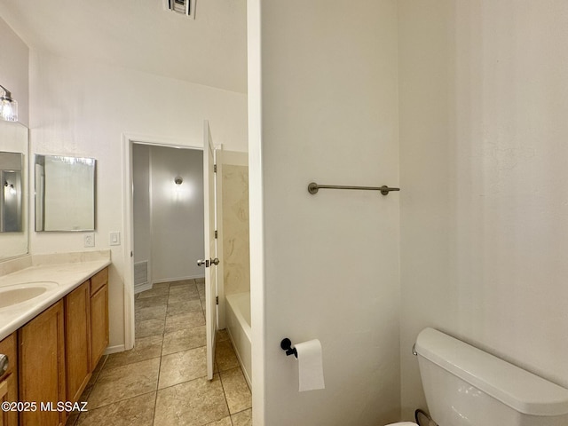 bathroom featuring vanity, tile patterned floors, visible vents, and toilet