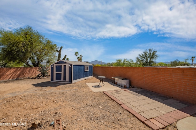 7571 N Rae Ave, Tucson, AZ 85741 - fenced backyard featuring a patio area and an outbuilding