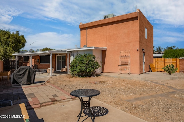 7571 N Rae Ave, Tucson, AZ 85741 - back of house featuring a patio and stucco siding