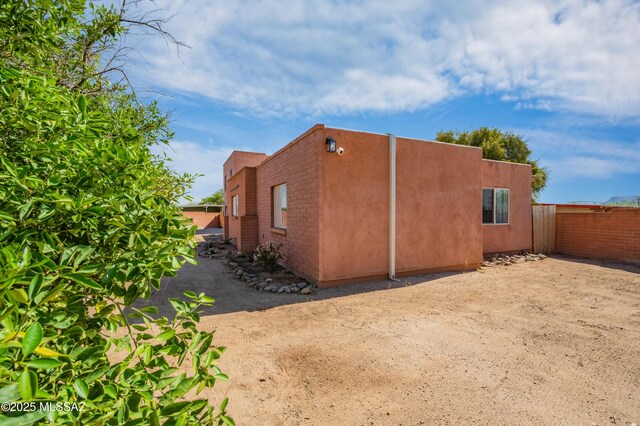 7571 N Rae Ave, Tucson, AZ 85741 - view of property exterior with stucco siding