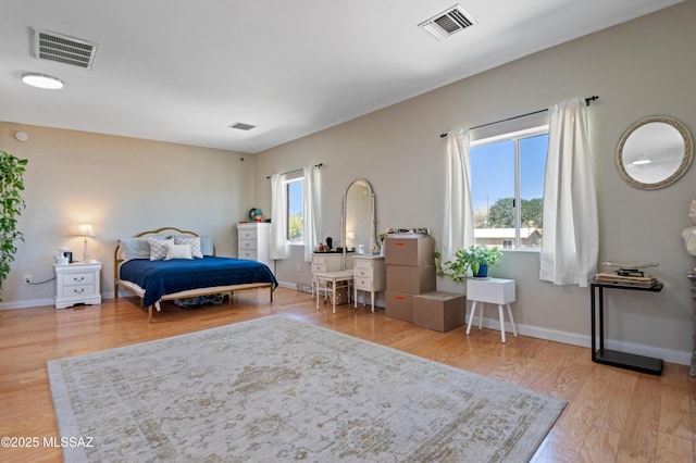 7571 N Rae Ave, Tucson, AZ 85741 - bedroom featuring wood finished floors and baseboards