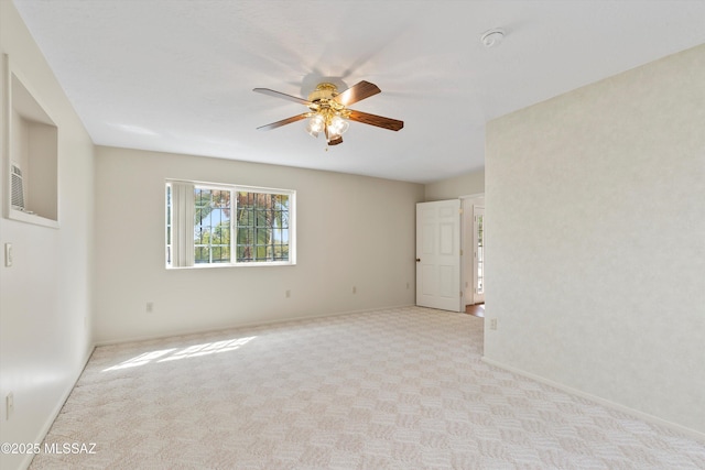 1011 N Placita Yoas, Green Valley, AZ 85614 - empty room featuring ceiling fan, light colored carpet, baseboards, and a smoke detector