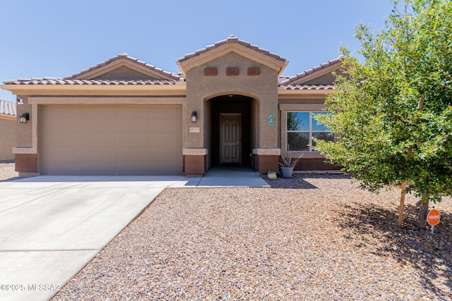 10157 N Sand Sage Trl, Marana, AZ 85653 - mediterranean / spanish house with stucco siding, a tiled roof, driveway, and a garage