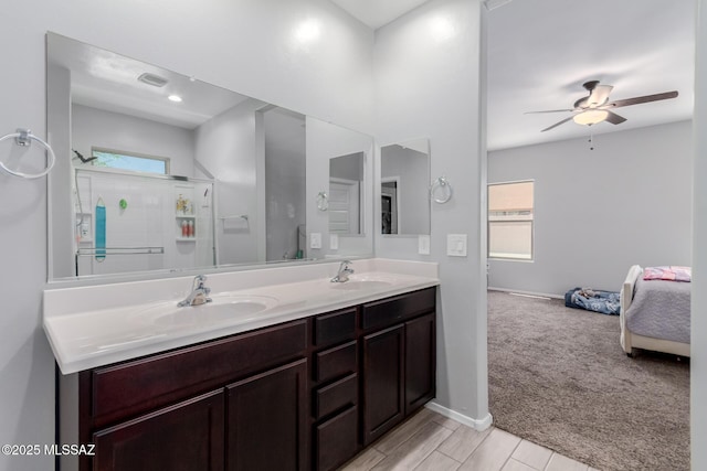 10157 N Sand Sage Trl, Marana, AZ 85653 - bathroom featuring double vanity, a sink, a ceiling fan, and walk in shower