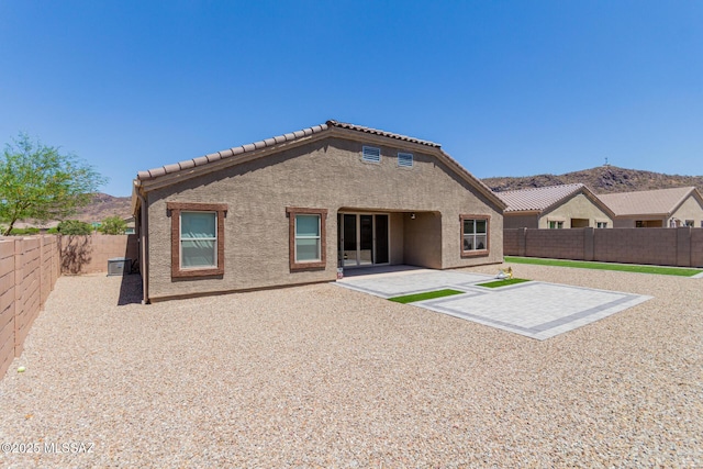 10157 N Sand Sage Trl, Marana, AZ 85653 - rear view of house with a tile roof, a fenced backyard, a patio area, and stucco siding