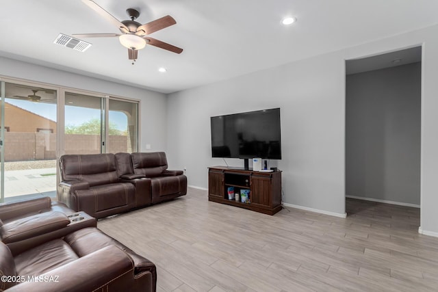 10157 N Sand Sage Trl, Marana, AZ 85653 - living area featuring a ceiling fan, baseboards, visible vents, and light wood finished floors