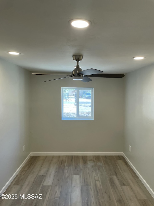 3923 E 17th St, Tucson, AZ 85711 - spare room with ceiling fan, wood finished floors, baseboards, and recessed lighting