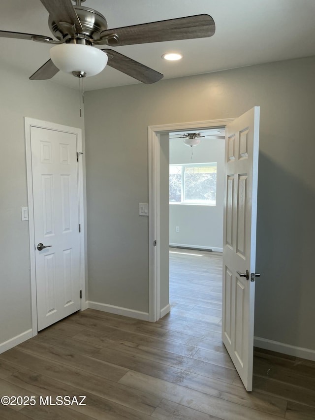 3923 E 17th St, Tucson, AZ 85711 - hall with wood finished floors, recessed lighting, and baseboards