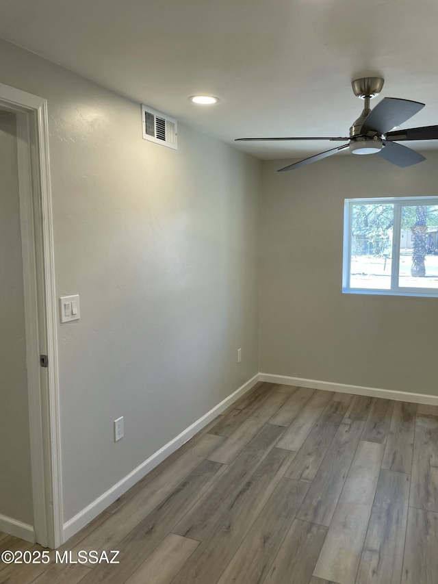 3923 E 17th St, Tucson, AZ 85711 - spare room featuring ceiling fan, wood finished floors, baseboards, and recessed lighting