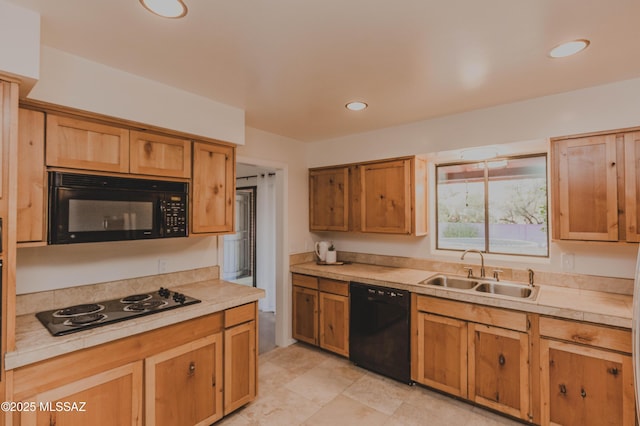 5417 E 3rd St, Tucson, AZ 85711 - kitchen featuring a sink, light countertops, black appliances, and recessed lighting