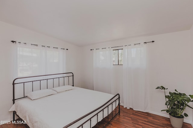 5417 E 3rd St, Tucson, AZ 85711 - bedroom with baseboards and wood finished floors