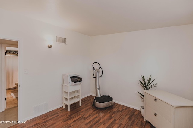 5417 E 3rd St, Tucson, AZ 85711 - misc room featuring visible vents, baseboards, and wood finished floors