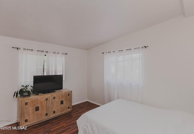 5417 E 3rd St, Tucson, AZ 85711 - bedroom featuring baseboards and dark wood-style flooring
