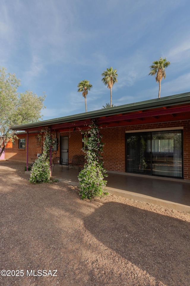 5417 E 3rd St, Tucson, AZ 85711 - view of front of house with a porch and brick siding