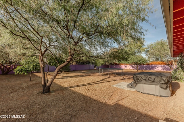 5417 E 3rd St, Tucson, AZ 85711 - view of yard with a fenced backyard and a trampoline