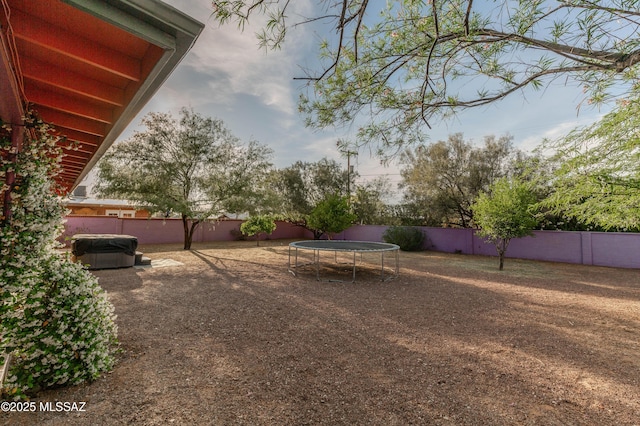 5417 E 3rd St, Tucson, AZ 85711 - view of yard featuring a fenced backyard and a trampoline
