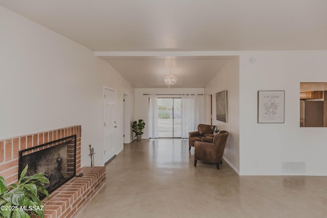 5417 E 3rd St, Tucson, AZ 85711 - living area featuring visible vents, a brick fireplace, baseboards, lofted ceiling with beams, and concrete floors