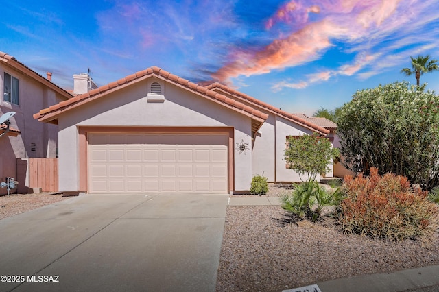 3564 W Sky Ridge Loop, Tucson, AZ 85742 - view of front of home featuring concrete driveway, stucco siding, an attached garage, and a tile roof
