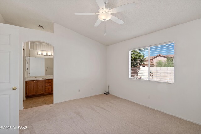 3564 W Sky Ridge Loop, Tucson, AZ 85742 - bathroom with tile patterned floors, toilet, double vanity, and a stall shower