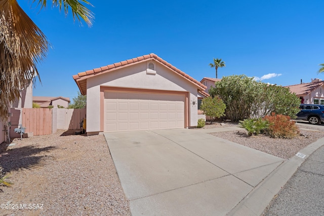 3564 W Sky Ridge Loop, Tucson, AZ 85742 - view of front facade with stucco siding, concrete driveway, a tiled roof, a gate, and a garage