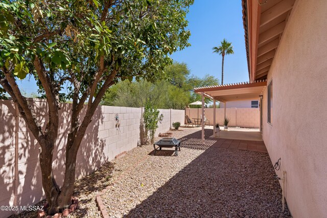 3564 W Sky Ridge Loop, Tucson, AZ 85742 - view of side of home featuring a patio, a tile roof, central AC, and stucco siding