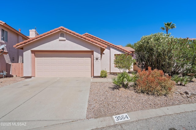 3564 W Sky Ridge Loop, Tucson, AZ 85742 - view of front of property with an attached garage, a tiled roof, driveway, and stucco siding