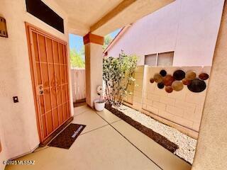 3564 W Sky Ridge Loop, Tucson, AZ 85742 - empty room featuring light tile patterned floors, ceiling fan, and a textured ceiling
