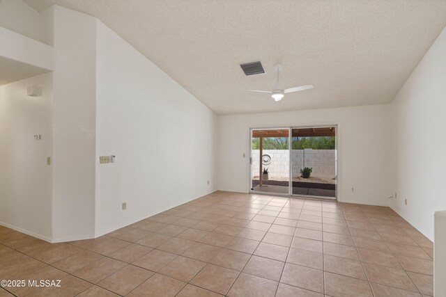 3564 W Sky Ridge Loop, Tucson, AZ 85742 - spare room with ceiling fan, light tile patterned flooring, a textured ceiling, and lofted ceiling