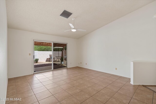 3564 W Sky Ridge Loop, Tucson, AZ 85742 - unfurnished living room featuring light tile patterned floors, vaulted ceiling, ceiling fan, and track lighting