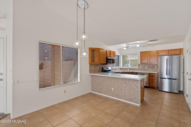 3564 W Sky Ridge Loop, Tucson, AZ 85742 - kitchen with stainless steel appliances, light countertops, a peninsula, and a sink