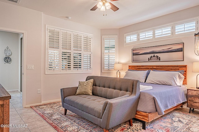 bedroom with baseboards, tile patterned flooring, ceiling fan, and visible vents