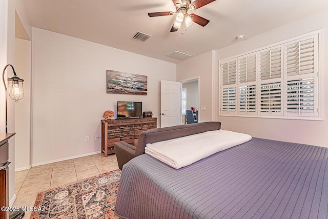 bedroom featuring visible vents, ceiling fan, and light tile patterned floors
