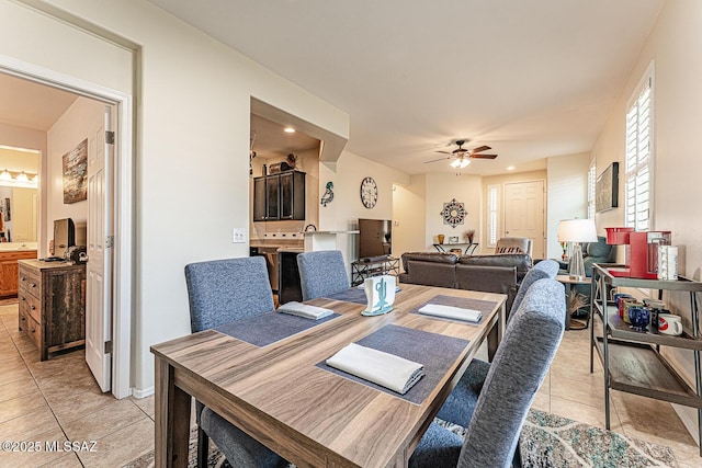 dining space with ceiling fan, recessed lighting, and light tile patterned flooring