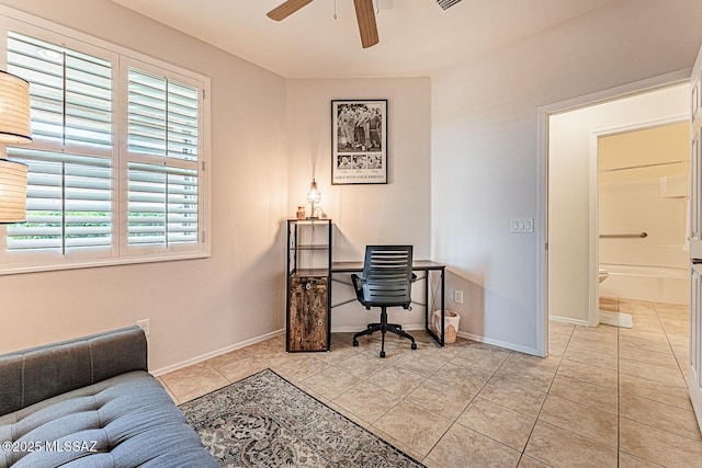 office featuring a ceiling fan, baseboards, visible vents, and light tile patterned floors