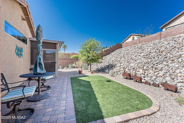 view of yard featuring a fenced backyard and a patio area
