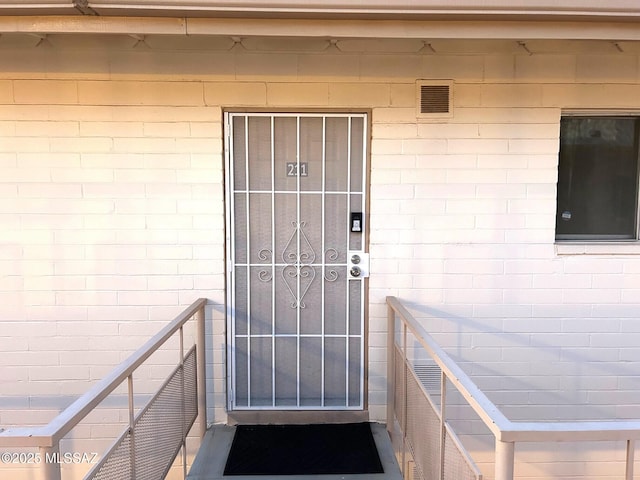 1470 S Palo Verde Ave, Tucson, AZ 85713 - property entrance featuring concrete block siding and visible vents