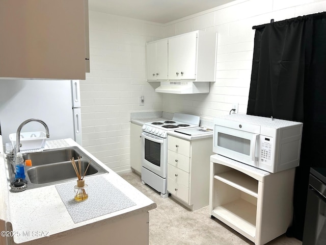 1470 S Palo Verde Ave, Tucson, AZ 85713 - kitchen with white appliances, light countertops, under cabinet range hood, white cabinets, and a sink