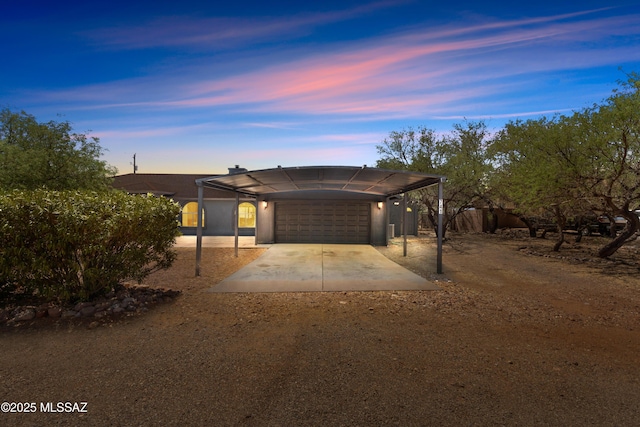 ranch-style home with an attached garage and driveway