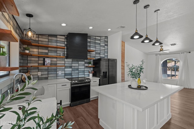 kitchen featuring open shelves, dark wood-style flooring, light countertops, a sink, and appliances with stainless steel finishes