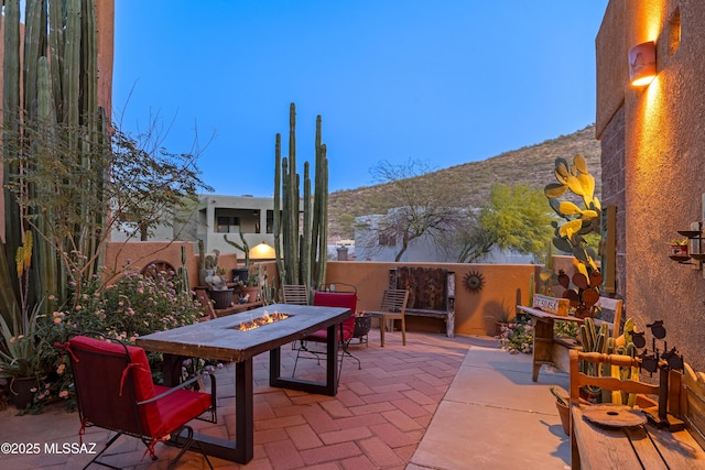 1408 W Kandy Ct, Tucson, AZ 85745 - view of patio / terrace featuring a fire pit, a mountain view, and a fenced backyard