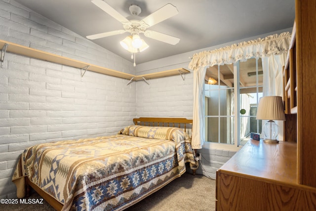 carpeted bedroom with ceiling fan and lofted ceiling