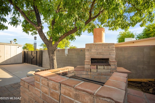 view of patio / terrace featuring fence