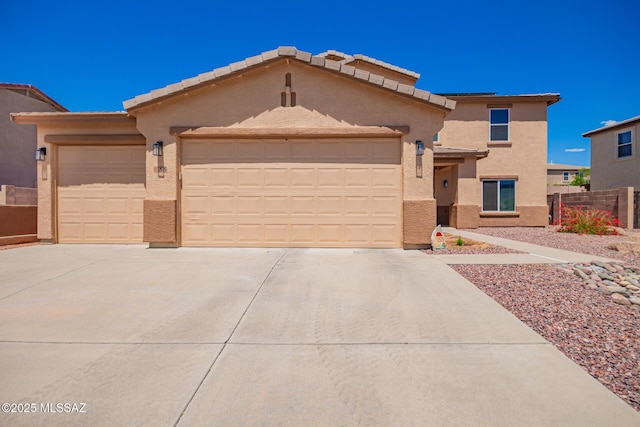 3575 E Mecate Rd, Tucson, AZ 85739 - view of front of house featuring fence, an attached garage, stucco siding, and concrete driveway