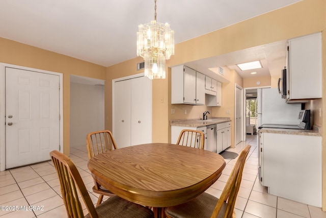 dining room featuring an inviting chandelier, light tile patterned flooring, and visible vents