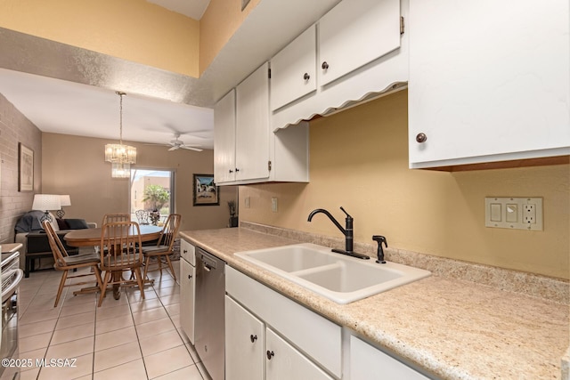 kitchen with stainless steel dishwasher, a sink, light countertops, light tile patterned floors, and white cabinetry