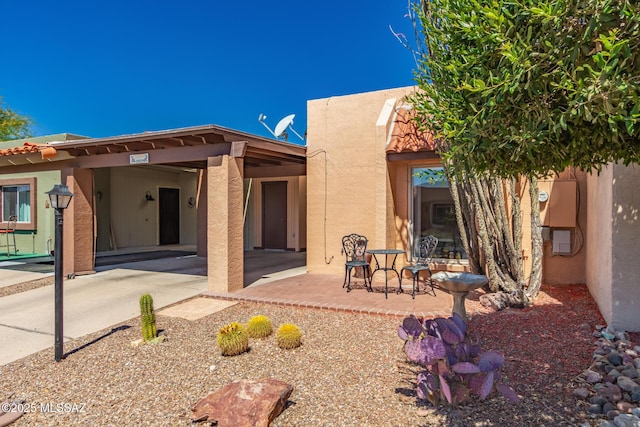 rear view of property with stucco siding