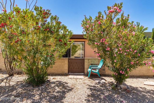 doorway to property with fence